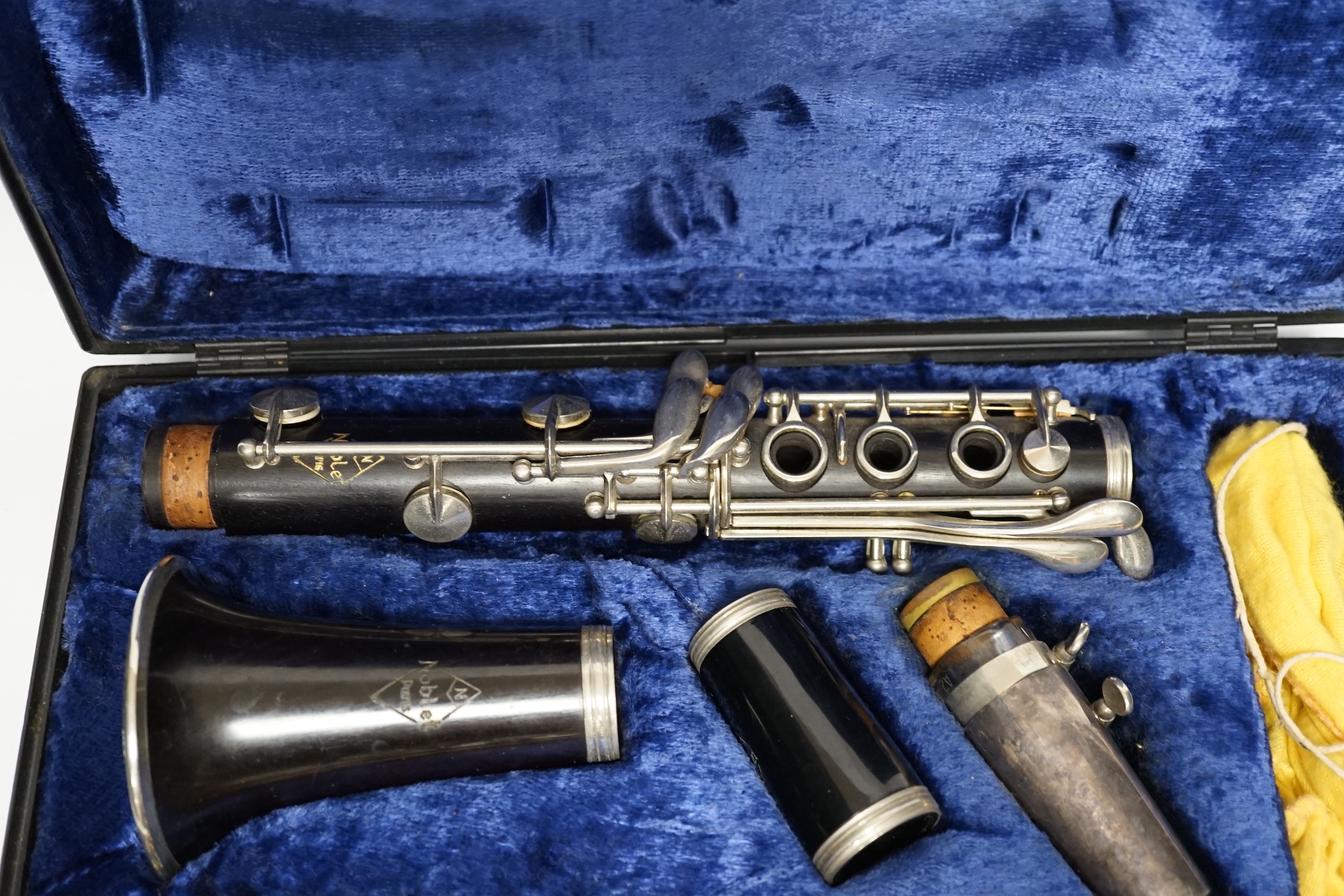 A cased French clarinet by Noblet, Paris